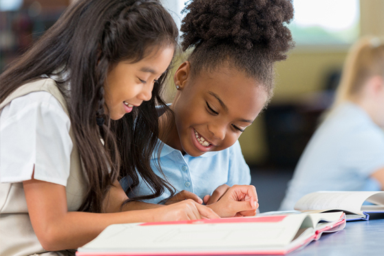 Foundation Smiling children in a classroom