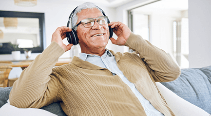 older man with headphones